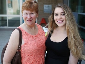 Fort McMurray evacuees Carmen Petrie and her daughter Tatum were photographed outside the SAIT residences on Sunday May 29, 2016. The Petrie family is both curious about what they will find when they eventually return but nervous about the health risks that remain in the town. Gavin Young/Postmedia