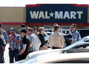 Mennonite youths gather in the Wal-Mart parking lot after church in Taber on Sunday April 17, 2016.