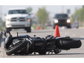A motorcycle lies in the roadway at the scene of a single-vehicle crash on Chaparral Boulevard SE Friday morning May 13, 2016.