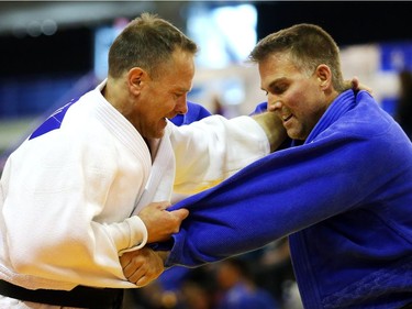 Jason Johnston of Alberta, right,  grapples with eventual winner Mike Horvey of Saskatchewan in the veterans 40 to 50 category at the Canadian Open Judo Championships Friday May 13, 2016 at the Olympic Oval.