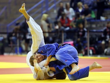 Adam Thompson of Calgary, in blue, grapples with Daniel Chosak-Barkay of Quebec in the under 18  kilogram category at the Canadian Open Judo Championships Friday May 13, 2016 at the Olympic Oval. Thompson won the match.