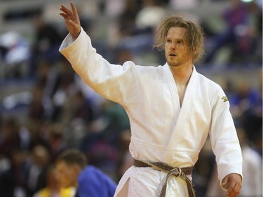 Kyle Crowell of St. Albert waves to the crowd after defeating Riley Maruyama of BC in the  at the Canadian Open Judo Championships Friday May 13, 2016 at the Olympic Oval.