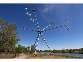 An osprey nest perches on the top of the Bloom sculpture on St. Patrick's Island on Sunday, May 15, 2016. Bloom was created by Montreal-born artist Michel de Broin, and is a seven storey high assembly of different street lights.