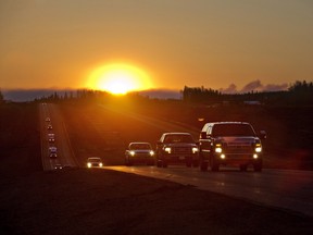 Evacuees leave Fort McMurray in the early morning, after being stranded north of a wildfire in Fort McMurray, on May 6, 2016.