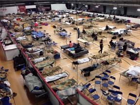 Cots litter the gym floor at an evacuee reception centre set up and operated by the regional municipality of Wood Buffalo in Anzac.