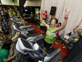 Dave Proctor celebrates setting a world record on a treadmill during the Calgary Marathon Expo at the Big Four Building in Calgary, Alta., on Saturday, May 28, 2016. Seven world records for treadmill running were broken, including Dave Proctor's 24-hour run, all in support of MitoCanada. Lyle Aspinall/Postmedia Network