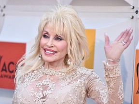 Dolly Parton arrives at the 51st annual Academy of Country Music Awards at the MGM Grand Garden Arena on Sunday, April 3, 2016, in Las Vegas. The legend will bring her Pure and Simple Tour to Calgary on Friday.