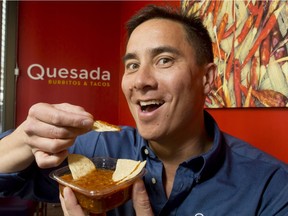 Steve Gill of Quesada Burritos and Tacos munches on some fresh salsa roja in his restaurant at the corner of 8 St and 5 Ave SW in Calgary, Alta., on Wednesday, April 27, 2016. He's showing ways to use chilli peppers as part of a lead-up to Cinco de Mayo. Lyle Aspinall/Postmedia Network
