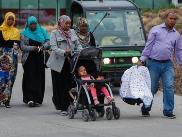 A family of evacuees from the Fort McMurray wildfires arrive at the evacuation centre in Edmonton on Thursday, May 5, 2016.