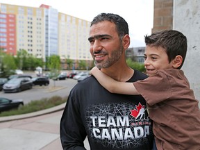 Fort McMurray evacuee Fadi Bawwab is looking forward to getting back to his downtown Fort McMurray home. He was photographed at the SAIT evacuee residence with his son Mohammed, 6,  on Wednesday, May 18, 2016.