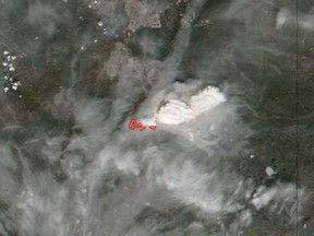 Satellite image showing the wildfire smoke above Fort McMurray, Alberta on May 3, 2016. Image is combined from images taken yesterday (May 3, 2016)  by two different satellite/instruments at two different times. The red marks indicate detected fires.
