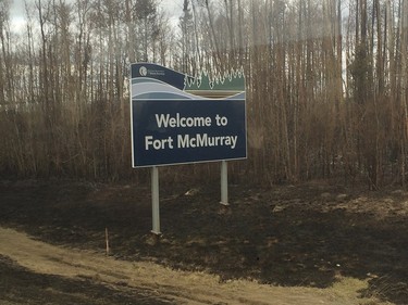 A Fort McMurray welcome sign as media enter the city for a bus tour after a wildfire forced the evacuation of the city.