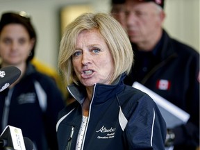 Premier Rachel Notley speaks to reporters in Fort McMurray on Monday after a tour of the fire-ravaged city.