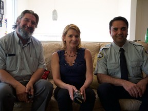 Left, Dan Storozuk, and right, Kulbir Chouhan, pictured with Bernadet Schneukere and her returned wallet.
