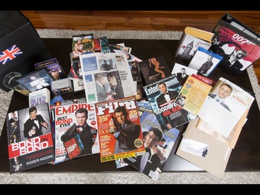 A cache of James Bond memorabilia sits inside Britton Walker's home in Calgary, Alta., on Monday, May 16, 2016. Walker, a huge James Bond fan who has appeared on Ellen and who through whom he met Bond actor Daniel Craig, was given a large portion of collector Wayne Rooke's extensive trove of James Bond memorabilia; his school paid forward the generosity by raising money for Fort McMurray fire victims. Lyle Aspinall/Postmedia Network