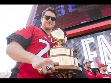 Rob Cote shows off his President's Ring trophy during the Calgary Stampeders Fanfest at McMahon Stadium in Calgary, Alta., on Saturday, May 14, 2016. The event featured player autographs, a pancake breakfasts and family games. Lyle Aspinall/Postmedia Network
