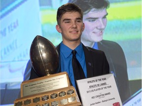 Bishop's University Gaitors' Jordan Heather receives the Hec Crighton Trophy as CIS football player of the year during Vanier Cup celebrations Thursday, November 21, 2013 in Quebec City.