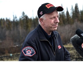 Fort McMurray Fire Chief Darby Allen gives an operational update to media at an RCMP checkpoint about 8 km south of Fort McMurray, May 12, 2016.