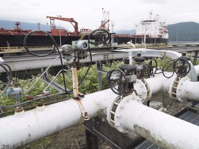 Land sales in the wider Western Canadian Sedimentary Basin fell to a 23-year low, according to RBC Capital Markets, as crude oil erased 45 per cent of its value.

A ship receives its load of oil from the Kinder Morgan Trans Mountain Expansion Project's Westeridge loading dock in Burnaby, British Columbia, on June 4, 2015. The British Columbia government's final submission to the National Energy Board says it is unable to support Kinder Morgan's proposed pipeline expansion from Alberta to the West Coast.B.C.