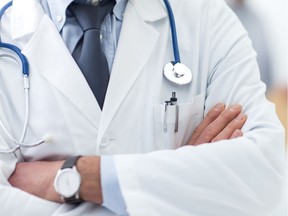 Local Input~ Doctor posing with arms crossed, lab coat, stethoscope and hands close up, healthcare professionals concept