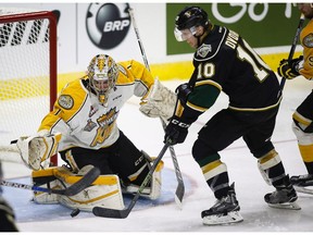 London Knights' Christian Dvorak, right, scores on Brandon Wheat Kings goalie Logan Thompson during third period CHL Memorial Cup hockey action in Red Deer, Monday, May 23, 2016.THE CANADIAN PRESS/Jeff McIntosh ORG XMIT: JMC111