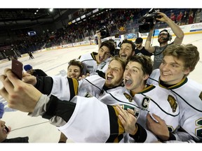 London Knights players pose for a selfie with goaltender Brendan Burke after winning the OHL Championship Series by beating the Niagara Ice Dogs 1-0 to sweep the series at the Meridian Centre in St. Catharines, Ont. on Wednesday May 11, 2016. Craig Glover/The London Free Press/Postmedia Network