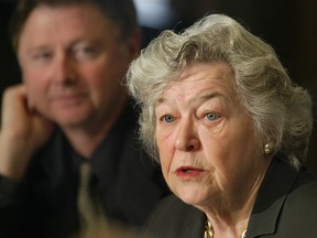March 2004: Lyle Oberg listens to Calgary Roman Catholic Separate School Chair Lois Burke-Gaffney speak during a press conference about funding for new schools.