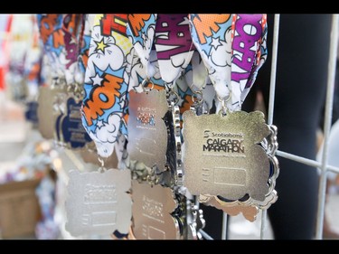 Medals wait for runners in the Calgary Marathon at the Stampede Grounds in Calgary, Alta., on Sunday, May 29, 2016. There were 5k, 10k, 21.1k, 42.2k and 50k distances in the race, including the half-marathon national championships. Lyle Aspinall/Postmedia Network