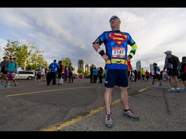 Mark Suchlandt strikes a Superman pose while warming up for the Calgary Marathon at the Stampede Grounds in Calgary, Alta., on Sunday, May 29, 2016. There were 5k, 10k, 21.1k, 42.2k and 50k distances in the race, including the half-marathon national championships. Lyle Aspinall/Postmedia Network