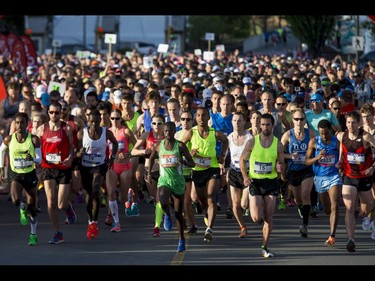 Runners break from the starting line for the Calgary Marathon at the Stampede Grounds in Calgary, Alta., on Sunday, May 29, 2016. There were 5k, 10k, 21.1k, 42.2k and 50k distances in the race, including the half-marathon national championships. Lyle Aspinall/Postmedia Network