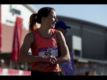 Jessica O'Connell rests after winning the women's 10-km portion of the Calgary Marathon at the Stampede Grounds in Calgary, Alta., on Sunday, May 29, 2016. There were 5k, 10k, 21.1k, 42.2k and 50k distances in the race, including the half-marathon national championships. Lyle Aspinall/Postmedia Network