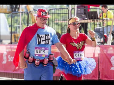 Ken and Rhonda Shebib finish the 10-km portion of the Calgary Marathon at the Stampede Grounds in Calgary, Alta., on Sunday, May 29, 2016. There were 5k, 10k, 21.1k, 42.2k and 50k distances in the race, including the half-marathon national championships. Lyle Aspinall/Postmedia Network