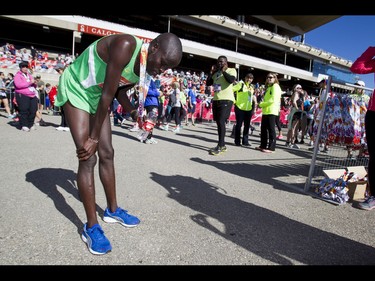 Jonathan Kipchirchir Chesoo of Kenya rests after winning the Calgary Marathon at the Stampede Grounds in Calgary, Alta., on Sunday, May 29, 2016. There were 5k, 10k, 21.1k, 42.2k and 50k distances in the race, including the half-marathon national championships. Lyle Aspinall/Postmedia Network