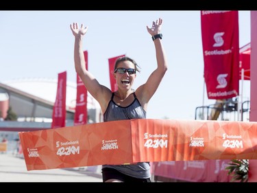 Andrea Glover wins the women's portion of the Calgary Marathon at the Stampede Grounds in Calgary, Alta., on Sunday, May 29, 2016. There were 5k, 10k, 21.1k, 42.2k and 50k distances in the race, including the half-marathon national championships. Lyle Aspinall/Postmedia Network