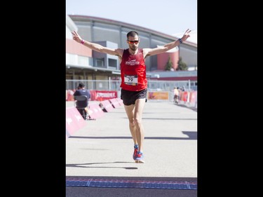 Calum Neff finishes second in the 50-km ultra portion of the Calgary Marathon at the Stampede Grounds in Calgary, Alta., on Sunday, May 29, 2016. There were 5k, 10k, 21.1k, 42.2k and 50k distances in the race, including the half-marathon national championships. Lyle Aspinall/Postmedia Network