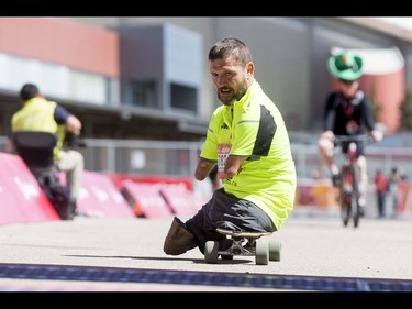 Chris Koch crosses the finish line of the Calgary Marathon at the Stampede Grounds in Calgary, Alta., on Sunday, May 29, 2016. There were 5k, 10k, 21.1k, 42.2k and 50k distances in the race, including the half-marathon national championships. Lyle Aspinall/Postmedia Network