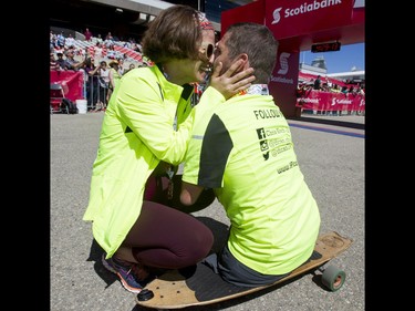 Chris Koch is greeted by his girlfriend Ally Iseman after finishing the finish line of the Calgary Marathon at the Stampede Grounds in Calgary, Alta., on Sunday, May 29, 2016. There were 5k, 10k, 21.1k, 42.2k and 50k distances in the race, including the half-marathon national championships. Lyle Aspinall/Postmedia Network