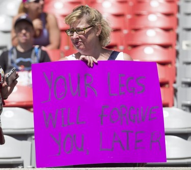 An apropos sign is held the Calgary Marathon at the Stampede Grounds in Calgary, Alta., on Sunday, May 29, 2016. There were 5k, 10k, 21.1k, 42.2k and 50k distances in the race, including the half-marathon national championships. Lyle Aspinall/Postmedia Network