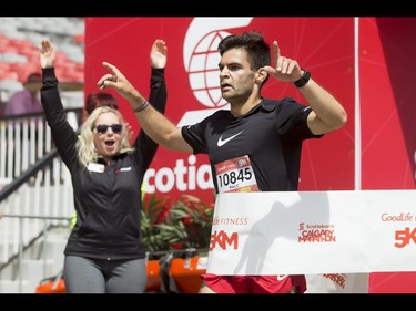 Malc Kent wins the men's 5-km portion of  the Calgary Marathon at the Stampede Grounds in Calgary, Alta., on Sunday, May 29, 2016. There were 5k, 10k, 21.1k, 42.2k and 50k distances in the race, including the half-marathon national championships. Lyle Aspinall/Postmedia Network