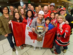 Surrounded by family and friends, Matt Dumba holds Team Canada's championship trophy at the Calgary International Airport in Calgary on Monday, May 23, 2016. He was part of Team Canada, returning from Russia after winning the country's second-straight gold medal in the IIHF World Hockey Championships.