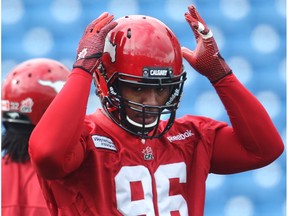 Calgary Stampeders defensive lineman Brandon Thurmond pulls on his helmet during practice at McMahon Stadium Wednesday September 16, 2015. (File)