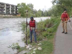 Crews use survey equipment on the Elbow River near 25 Ave SW as they monitor a controlled high-flow event in preparation for the upcoming flood readiness season in Calgary, Alta on Tuesday May 10, 2016. The water is expected to rise my approx a metre, but will return to normal by end of the day.