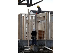 Framers work on a single-family home in the northeast community of Cityscape.
