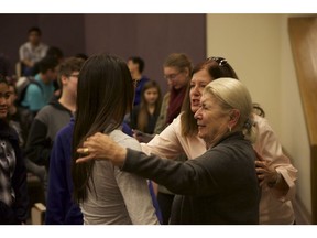 Fanny Wedro talks to an emotional high school student after speaking about her experience as a Jew in Ukraine during the Holocaust.