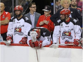 No joy on the Calgary Roughnecks bench as Reilly O'Connor, Jeff Shattler and Wesley Berg suffer their defeat by the Saskatchewan Rush in NLL action at the Scotiabank Saddledome in Calgary, Alta. on Saturday, May 14, 2016. The Rush beat the Roughnecks 16-10. Mike Drew/Postmedia