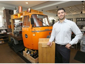 Tony Nicastro, owner of PZA Parlour, poses in his restaurant space at Southland Crossing in Calgary, Alta Thursday May 5, 2016. Nicastro comes from a long line of Calgary restauranteurs and is standing next to a converted Vespacar which serves cappucino etc on one side and the other houses some prized liquors. Jim Wells/Postmedia