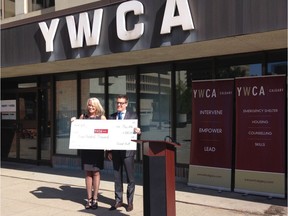 On Monday, May 16, 2016, Christopher Wein, president of Great Gulf, presents Sue Tomney, CEO YWCA of Calgary, with a cheque for $500,000 as seed funding for its eventual move to another location. Great Gulf acquired the YWCA land last fall, and plans a mixed use development with up to five towers on the site.