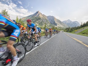 Cyclists race up Highway 40 during the Gran Fondo Highwood Pass 2015.