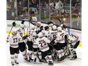 REBELS VS. HITMEN--The Red Deer Rebels crowd around their net as they celebrate their Game 5 and series win over the Calgary Hitmen at the Enmax Centrium in Red Deer, Alta. Saturday night. Photo by ASHLI BARRETT/Red Deer Advocate