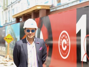 Riaz Mamdani, president of Strategic Group, stands in front of the construction site of Centro, Calgary's first five-storey wood-frame building.